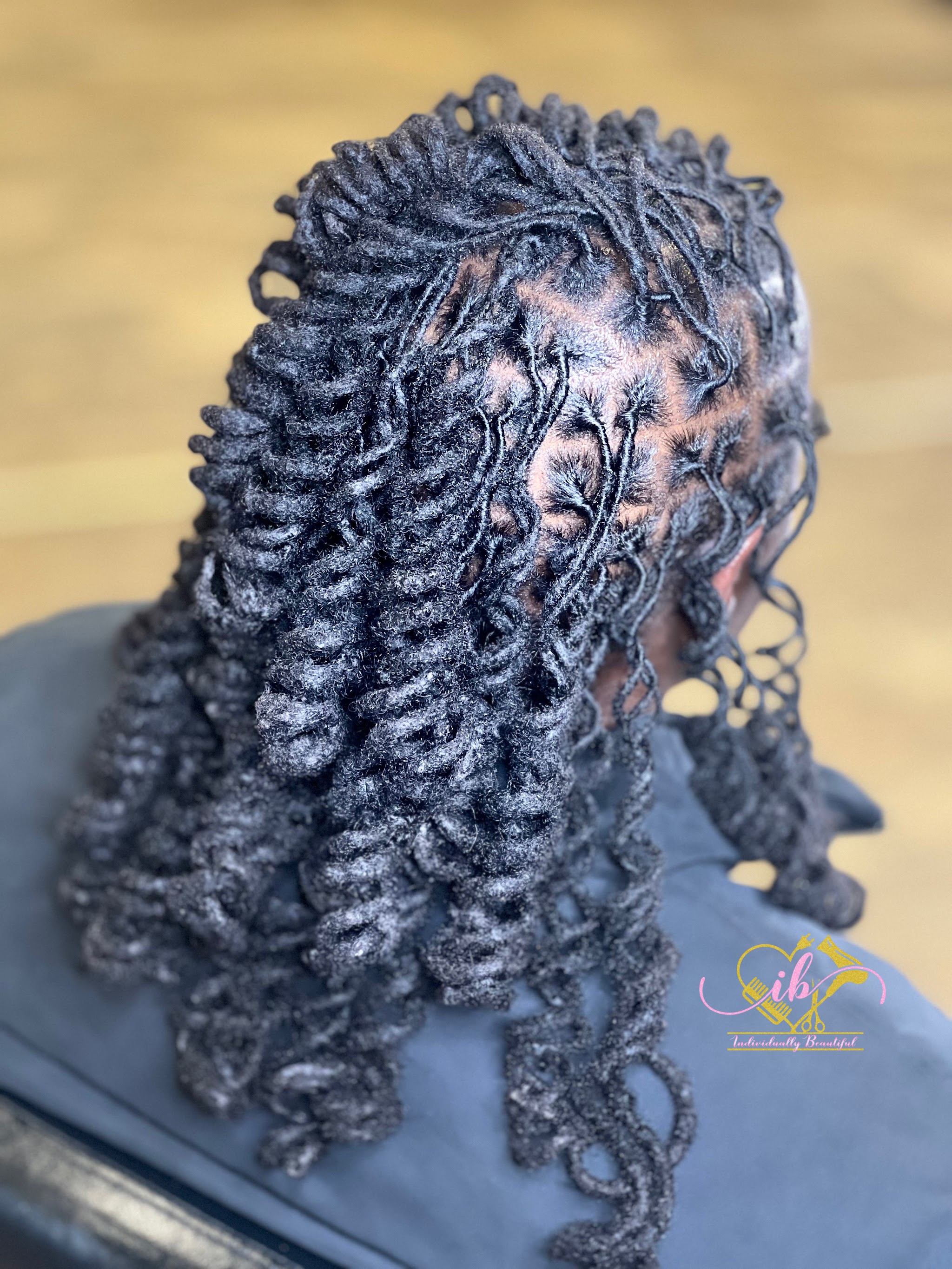 Twisted locs with a soft curl finish